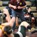 Dexter wresling coach Greg Wagner watches a match between Dexter's Alex Reich and Freeland's Cavin Compton. Angela J. Cesere