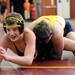 Dexter's Shawn Adamas, left, tries to get out from underneath Gaylord's Matt Kempfer durin gthe 125 lb weight class match. Angela J. Cesere