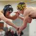 Dexter's Blake Wingler, right, tries to gain the advantage of Gaylord's Alex Webber durin ghte 152 lb weight class match. Angela J. Cesere