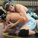 Skyline's Winston Wei tries to get out from beneath Lumen Christi's Evan Kueffner during the171 lb weight class match. Angela J. Cesere