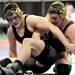 Manchester's Austin Hamilton, right, tries to gain the advantage of Elkton Pigeon Bay Port Lake's Jeff Diebel during the 215 lb weight class quarter final match at the Palace of Auburn Hills during the MHSAA individual wrestling finals. Angela J. Cesere | AnnArbor.com
