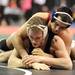 Chelsea's Mike Hovater tries to escape from the grasp of St Johns' Taylor Massa during the Div. 2, 171 lb weight class match during the MHSAA individual wrestling finals at the Palace of Auburn Hills. Angela J. Cesere | AnnArbor.com