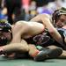 Manchester's Eric Coval, tries to gain the advantage of Hudson's Luke Sparapani during the Div. 4, 135 lb weight class match at the MHSAA individual wrestling finals at the Palace of Auburn Hills. Angela J. Cesere | AnnArbor.com