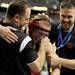 Milan's Chris Gaskill hugs celebrates with coaches Todd Federer, right, and Clint Kraft after his last second win against New Boston Huron's Marcus Copley during the Div. 2, 160 lb weight class match during the MHSAA individual wrestling finals at the Palace of Auburn Hills. Angela J. Cesere | AnnArbor.com