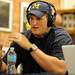 Former Michigan football player Jake Long talks on WTKA during the Mott Takeover at M-Den to raise funds for the University of Michigan's Mott Children's Hospital on Friday afternoon. Angela J. Cesere | AnnArbor.com
