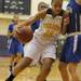 Ypsilanti Lincoln's Hannah Roe, right, tries to block Ypsilanti's Cara Easley from taking a shot. Angela J. Cesere