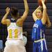 Ypsilanti Lincoln's Hannah Roe looks for a pass around Ypsilanti's Cara Easley. Angela J. Cesere
