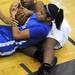 Ypsilanti Lincoln's Katelyn Morris, bottom, and Ypsilanti's Carneysha McGee fight for a loose ball. Angela J. Cesere