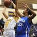 Ypsilanti Lincoln's Jaslynn Rollins, right, tries to block a shot by Ypsilanti's Tori Amison. Angela J. Cesere