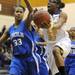Ypsilanti Lincoln's Jaslynn Rollins, left, tries to block a shot by Ypsilanti's Chasidy Chambers. Angela J. Cesere