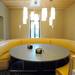 A light installation dangles above a large round booth  in the dinning hall. Melanie Maxwell | AnnArbor.com