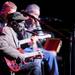 From left: David "Honeyboy" Edwards plays guitar and sings with Steve "Lightnin'" Malcolm on guitar and Michael Frank on harmonica during the Blues at the Crossroads: The Robert Johnson Centennial Concert at Hill Auditorium in Ann Arbor, Mich. on Feb. 10, 2011. Angela J. Cesere | AnnArbor.com