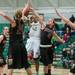 Huron's Micah Robinson jumps to make a shot as Dexter's Makenzie Svihra tires to block her, Tuesday Feb. 5th.
Courtney Sacco I AnnArbor.com 