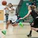 Huron's Micah Robinson passes the ball as she is guarded by Dexter's Riley McDonald during the third quarter of their game, Tuesday Feb. 5th.
Courtney Sacco I AnnArbor.com 