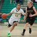 Huron's Micah Robinson dribbles the ball down court against Dexter's Riley McDonald during the fourth quarter of their game at Huron high school Tuesday Feb. 5th.
Courtney Sacco I AnnArbor.com  