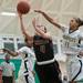 Dexter's Makenzie Svihra jumps to make a shot as Huron's Sara Golidy tries to block her.
Courtney Sacco I AnnArbor.com 