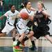 Huron's Bianca Williams drives the ball past Dexter'sRiley McDonald during the third quarter of their game, Tuesday Feb. 5th.
Courtney Sacco I AnnArbor.com 