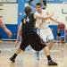 Skyline's Peter Bakker-Arkema dribbles the ball down court as Dexter's Brandon Bednarz guards him.
Courtney Sacco I AnnArbor.com 