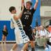 Dexter's Derek Seidl looks for an open team mate as Skyline's Jack Clark guards him during the first half of their game Tuesday Feb 12th.
Courtney Sacco I AnnArbor.com 