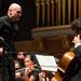 Guest conductor Michael Adelson leads the Pioneer Symphony Orchestra. 
Courtney Sacco I AnnArbor.com     
