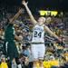 Wolverines Jenny Ryan jumps to make a shot  during the first half of their game against the Spartans Saturday Feb. 16th.
Courtney Sacco I AnnArbor.com    