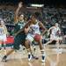 Wolverines Nya Jordan dribbles the against Spartans Klasissa Bell during the second half of their game Saturday Feb. 16th.
Courtney Sacco I AnnArbor.com 