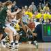 Wolverines Nya Jordan dribbles goes after a loos ball during the second half of their game Saturday Feb. 16th.
Courtney Sacco I AnnArbor.com 