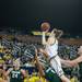 Wolverines Kate Thompson jumps in to Spartans Kiana Johnson to make a shot during the second half of their game Saturday Feb. 16th.
Courtney Sacco I AnnArbor.com 
