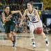 Wolverines Kate Thompson drives the ball down court against Spartans Klarssa Bell during the second half of their game Saturday Feb. 16th.
Courtney Sacco I AnnArbor.com 