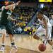 Wolverines Nya Jordan drives the ball past Spartans Annalise Pickrel during the first half of their game Saturday Feb. 16th.
Courtney Sacco I AnnArbor.com  