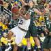 Wolverines Nya Jorden jumps to make a shot against Spartans Courtney Schiffauer during the first half of their game Saturday Feb. 16th.
Courtney Sacco I AnnArbor.com    