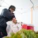 Jonathan Goetz from Goetz's Greenhouse bags up lettuce for a customer at the Ann Arbor Farmers Market on Saturday. During the winter, there are fewer vendors and customers, but the diehards still show up. 
Courtney Sacco I AnnArbor.com 