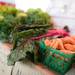 Greens and carrots from Goetz's Greenhouse sit on display at the Ann Arbor Farmers Market. 
 Courtney Sacco I AnnArbor.com 