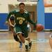 Huron's Antonio Henry dribbles the ball down the court against during the first half of their game Tuesday night.
Courtney Sacco i AnnArbor.com 