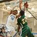 Skyline's Tristan Wilson has the ball nocked out of his hands by Huron's Xavier Cochran as he tries to make a basket.
Courtney Sacco I AnnArbor.com 