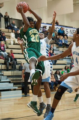 Huron's Demetrius Sims jumps to make a rebound during the first half of their game against Skyline Tuesday night.
Courtney Sacco i AnnArbor.com 