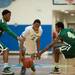 Skyline's Isaac Lockhart dribbles the ball down court as he is guarded by two Huron players.
Courtney Sacco I AnnArbor.com 