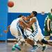 Skyline's Sharath and Huron's Nasheed Bass run after a loos ball doing the first half of their game Tuesday night
Courtney Sacco I AnnAarbor.com 