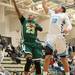 Huron's Brian Walker jumps to make a basket as Skyline's Jack Clark tries to block his shot.
Courtney Sacco I AnnArbor.com 