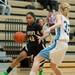 Huron's Micah Robinson drives the ball past Skyline's Anita Vandermeulen during the second half of their game at Skyline High School Tuesday night.
Courtney Sacco I AnnArbor.com  