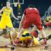 Wolverines Nicole Elmbland dives after a loos ball during the first half of their game against the Cornhuskers Thursday night.
Courtney Sacco I AnnArbor.com 