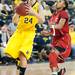 Wolverines Jenny Ryan jumps to make a basket after dribbling past  Cornhuskers Tear'a Laudermill during the first half of their game Thursday night.
Courtney Sacco I AnnArbor.com 