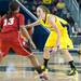 Wolverines Nicole Elmblad looks for a way past Cornhuskers Brandi Jeffery during the first half of their game Thursday night.
Courtney Sacco I AnnArbor.com 