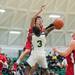 Beford's Jackson Lamb hits the ball out of Huron's Ernest Johnson's hands as he tries to shoot a basket during second half of their game Thursday evening at Huron High School.
Courtney Sacco I AnnArbor.com 