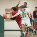 Huron's Thomas Logue fouls Bedford's Jackson Lamb during second half of their game Thursday evening at Huron High School.
Courtney Sacco I AnnArbor.com 