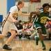 Huron's Demetrius Sims drives the ball down court against Dexter's Kyle VanDusen during the Class A district semifinals at Skyline High School Wednesday Mar. 6th.
Courtney Sacco I AnnArbor.com   