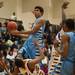 Eagles Tristan Wilson drives in to Phoenix's Jalen Harmon, fouling him as he tries to make a basket.
Courtney Sacco I AnnArbor.com 
