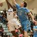 Phonenix's Jacob Simmons and The Eagles Chris Spaly both jump as they try to make a rebound during the fist half of the Class A district semifinals at Skyline High School Wednesday Mar. 6th.
Courtney Sacco I AnnArbor.com   