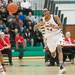 Ypsilanti's Jalen Harmon passes the ball as Ypsilanti drives the ball up court during first half of the regional semifinal game against Canton at Huron High School March 11.
Courtney Sacco I AnnArbor.com  