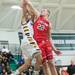 Canton's Gregory Williams hits the ball out of Ypsilanti's Janeau Joubert's hands as he goes for a layup during first half of the regional semifinal game at Huron High School March 11.
Courtney Sacco I AnnArbor.com  